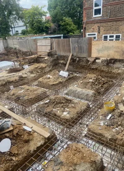London new build construction site coordinated from groundwork to completion