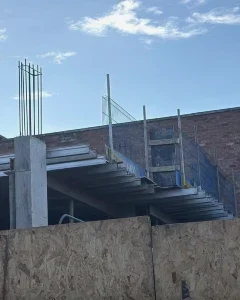 Principal Contractor managing residential construction paperwork and site safety